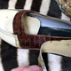 A Cayman crocodile skin shoe hidden behind cheap leather covering.